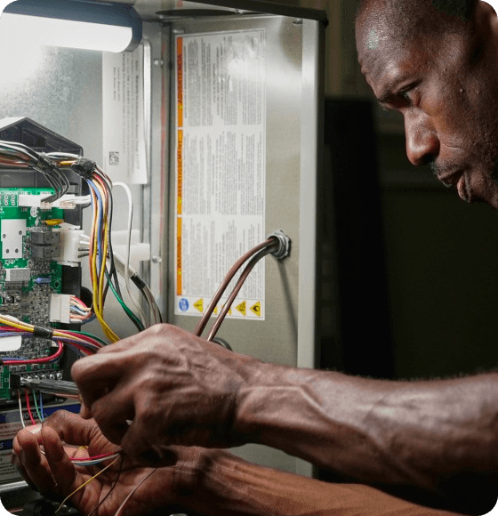 Trane specialist repairing an air conditioner
