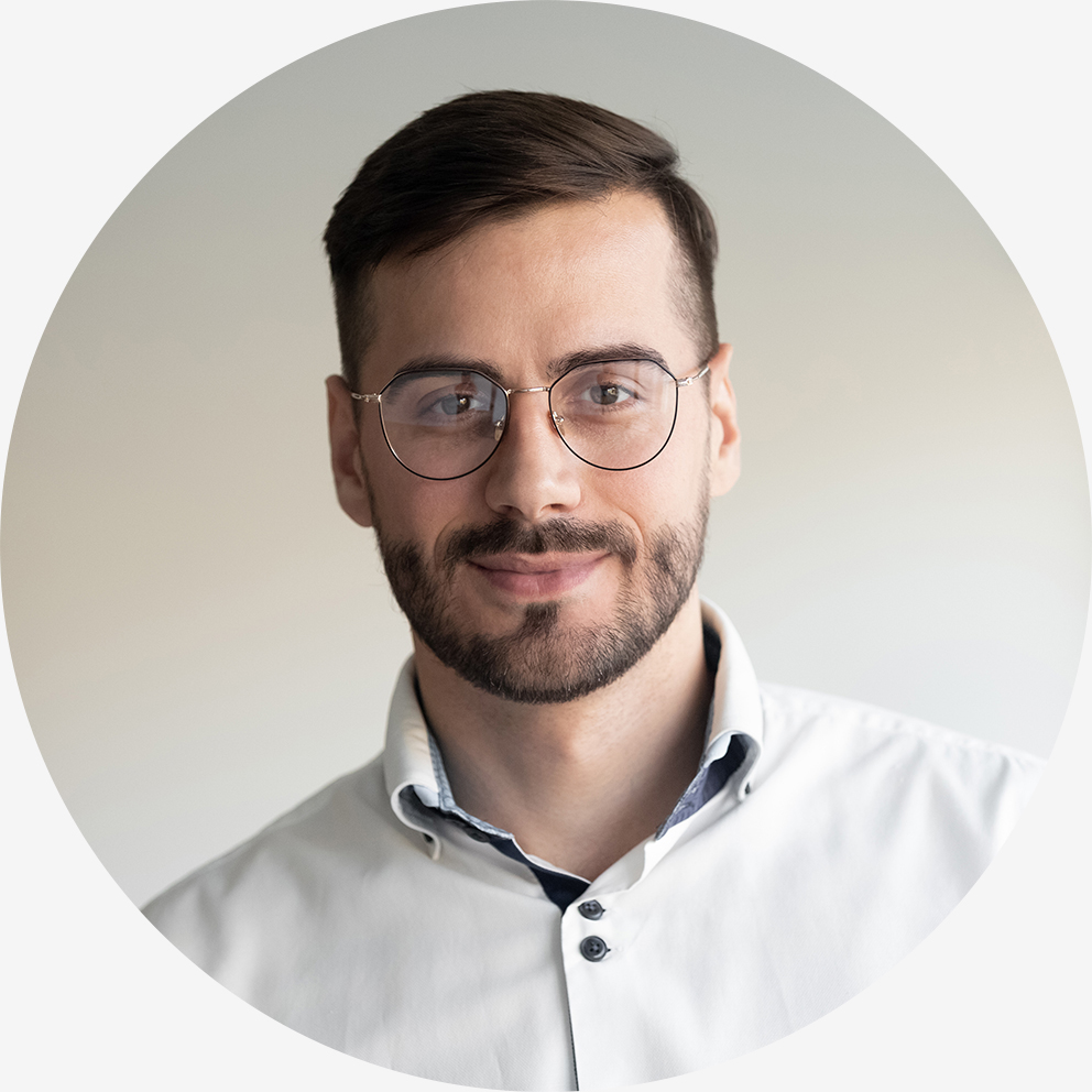 Portrait of millennial businessman posing looking at camera