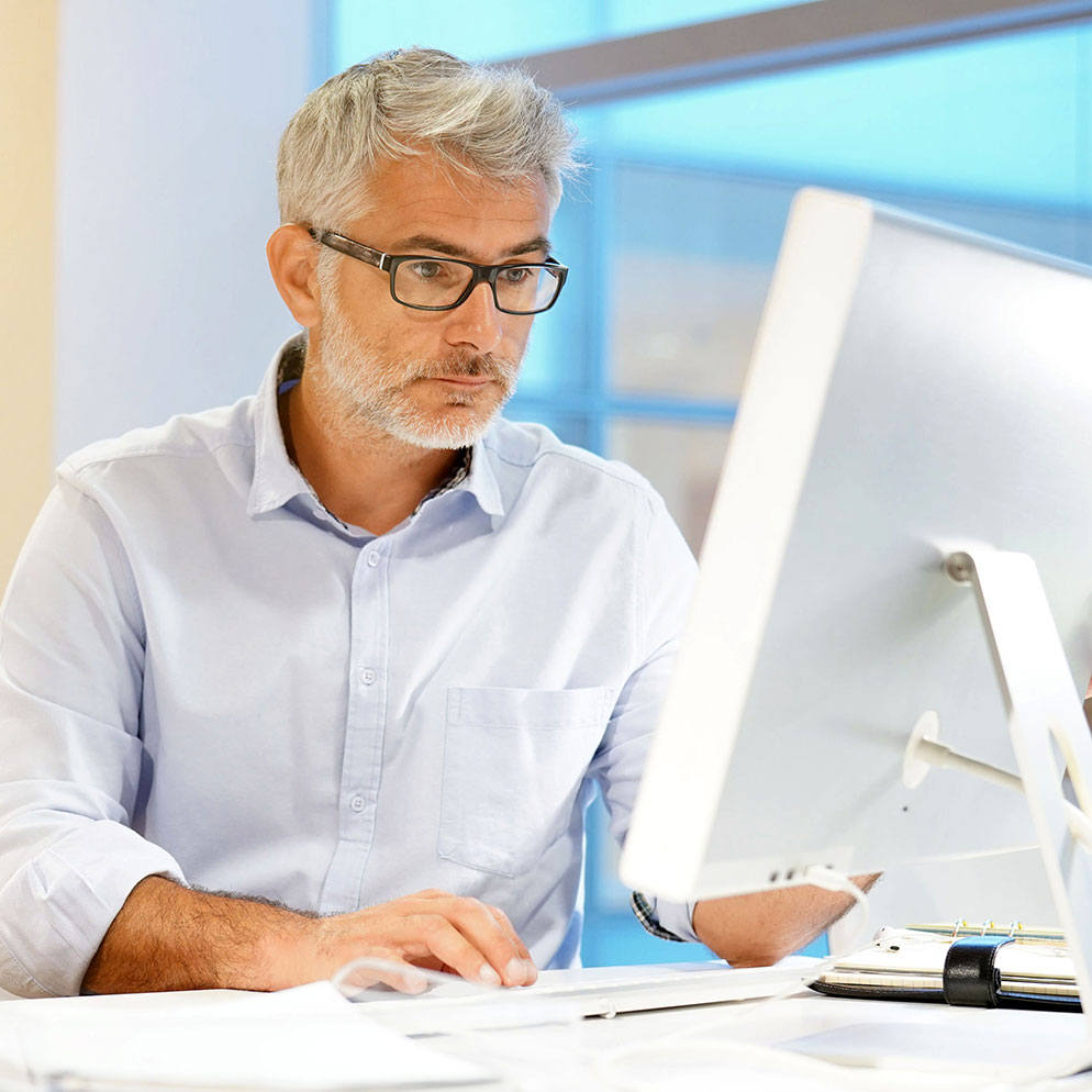 Smart casual businessman working in contemporary office