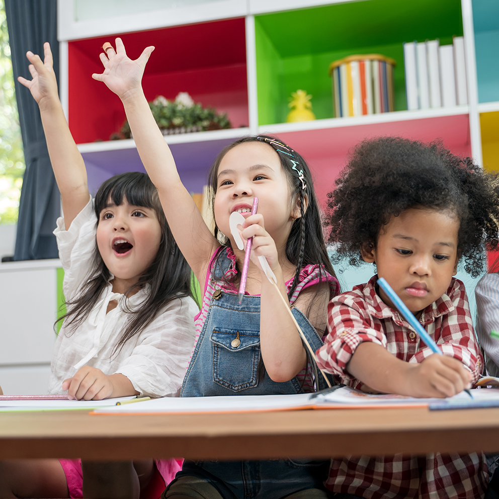 Group of little preschool kids drawing paper with color pencils . portrait of children friends education concept.